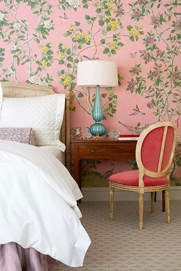 Cozy vintage bedroom with floral patterns, classic furniture, and charm.