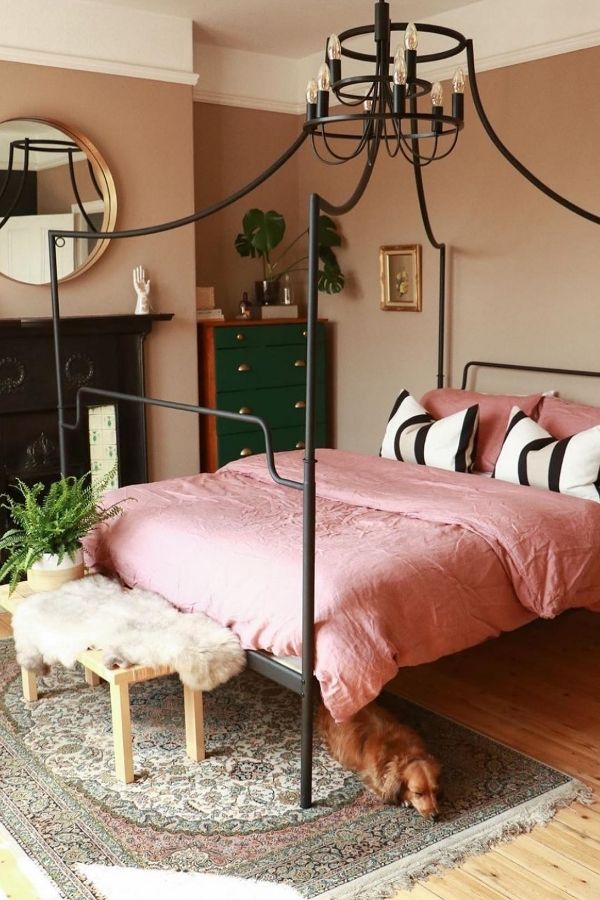 Chic pink bedroom featuring modern decor, stylish furniture, and cozy ambiance.