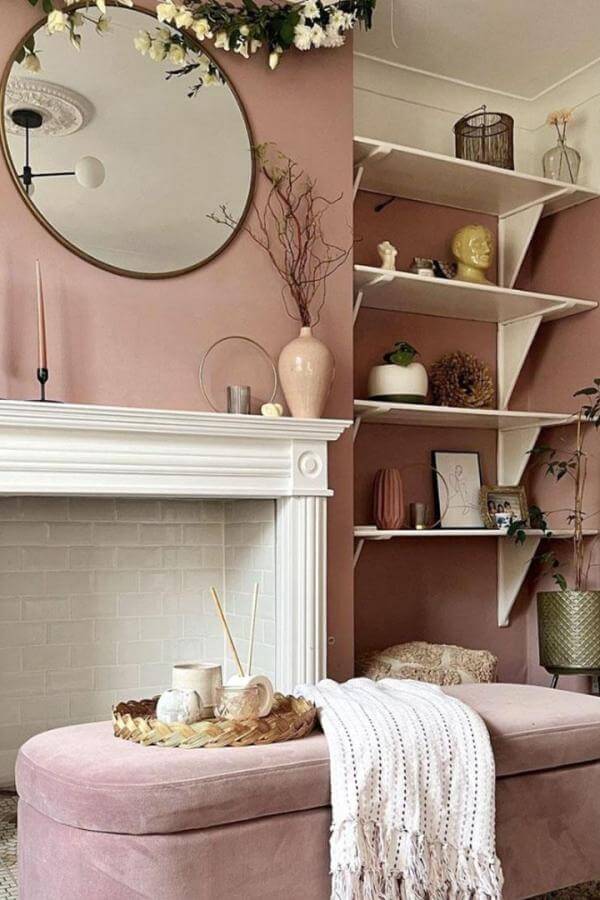 Chic mauve ambiance with elegant shelving; pink living room ideas.