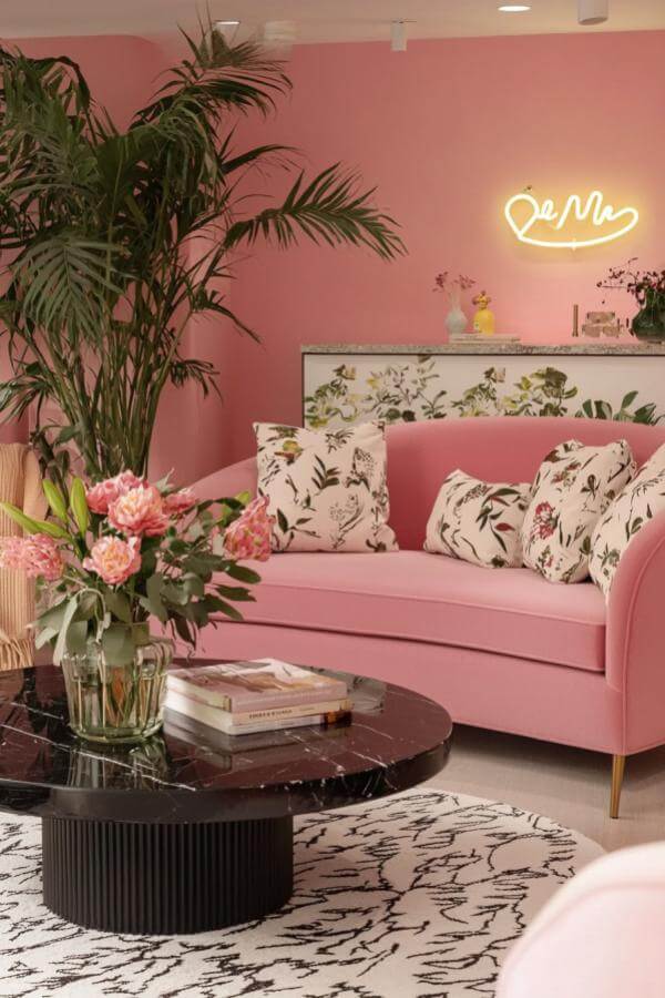 Neon glow enhances floral fantasy in stylish pink living room ideas.