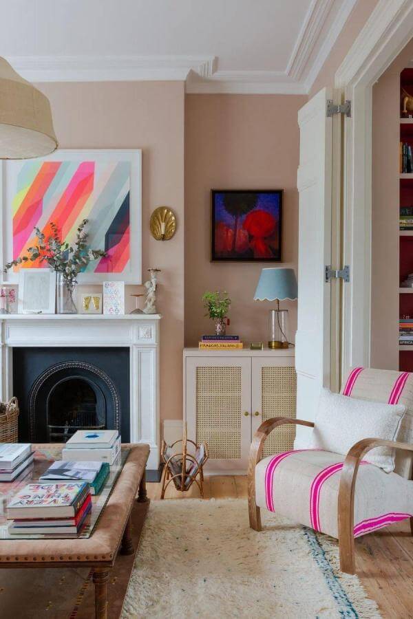 Vibrant stripes enhance cozy nook, showcasing pink living room ideas.