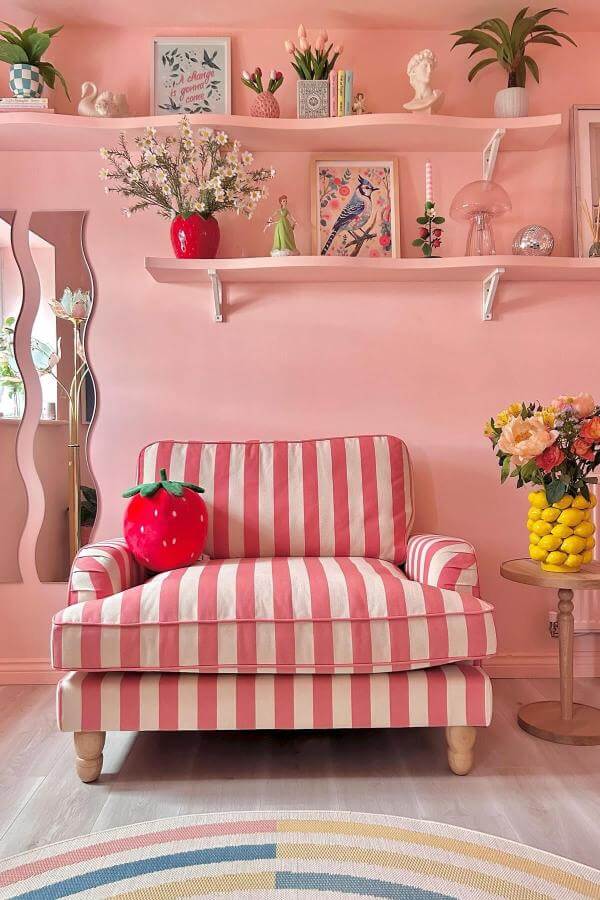 Bold stripes in pink living room ideas create a chic delight.