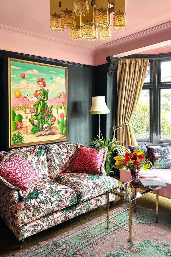 Cozy and vibrant with eclectic decor; pink living room ideas.