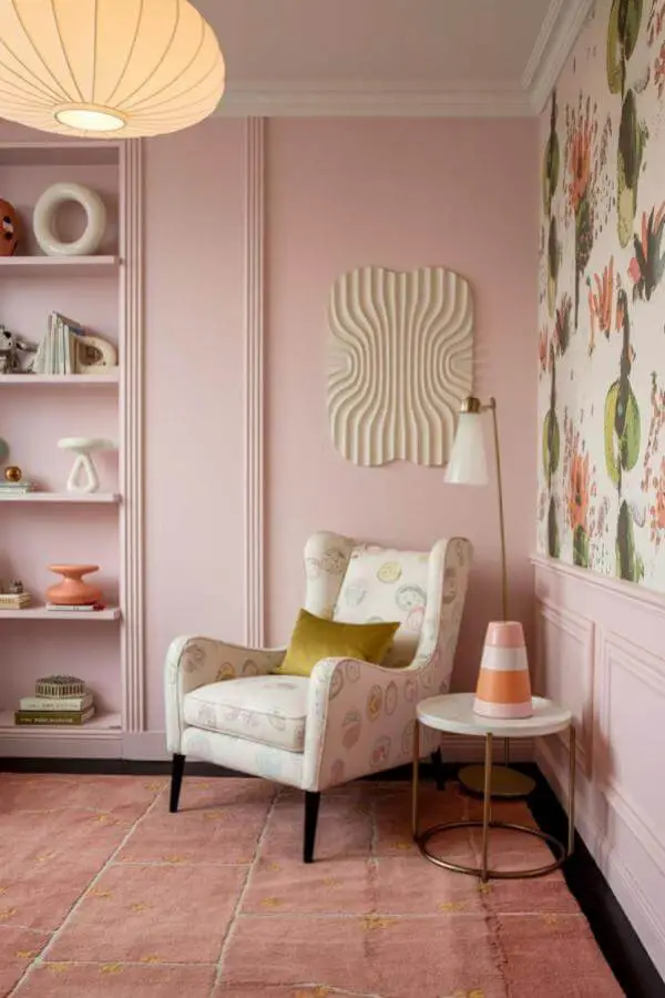Soft pastel walls with cozy nook from art-inspired walls light up this pink teenage girl bedroom.