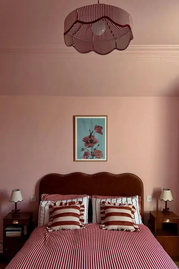Bold pink and white striped wall from @letsby.avenue for a playful pink teenage girl bedroom statement.