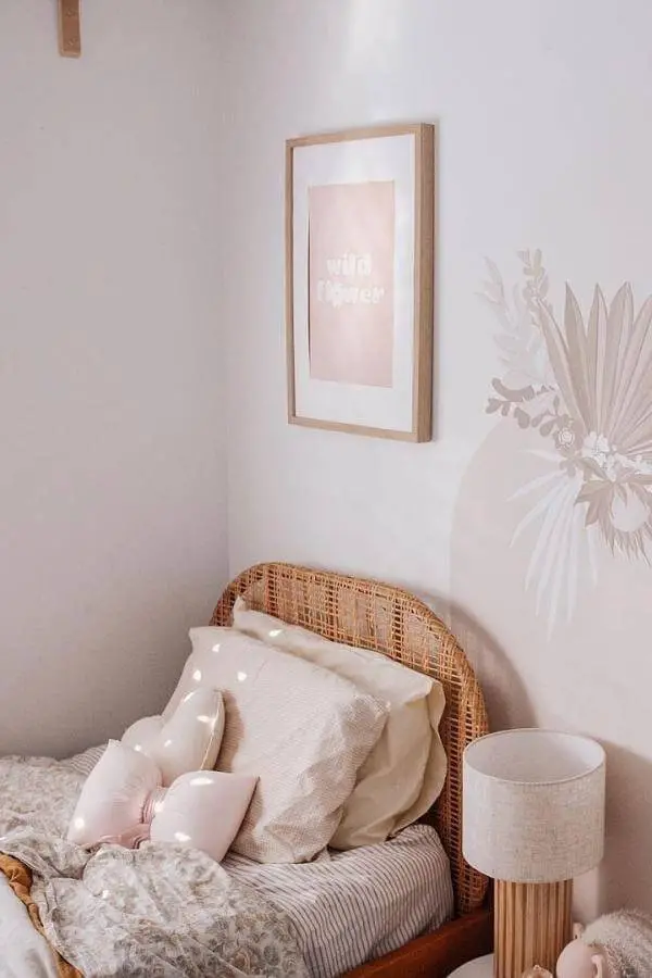 Soft pink glow with dreamy rattan headboard from @pepperminttreecreations. Cozy, stylish vibe for relaxing spaces.