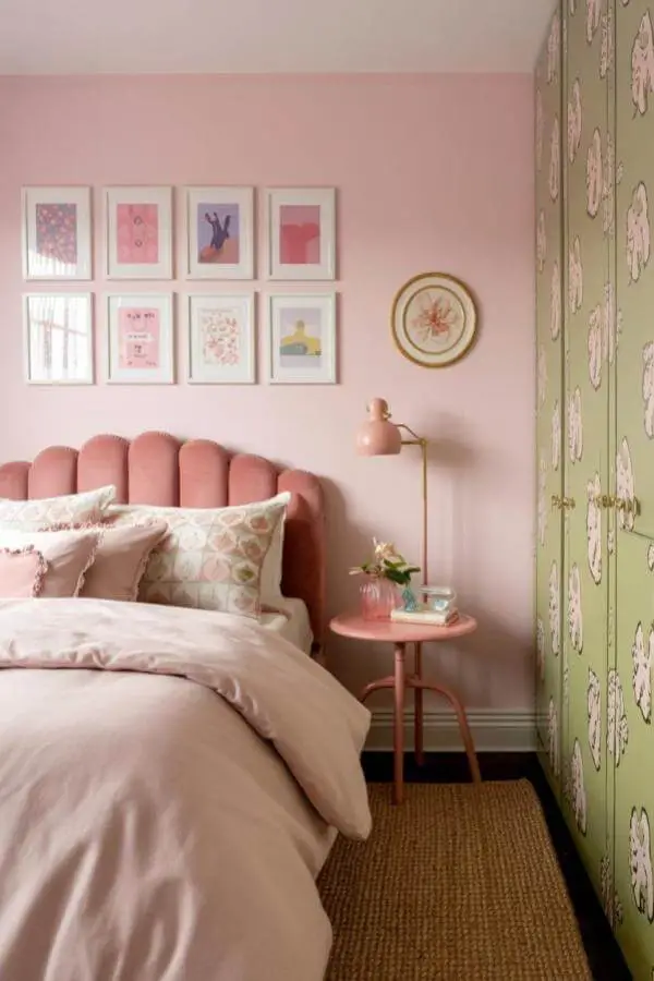 Floral green wardrobe pops in pretty pink teenage girl bedroom retreat with soft pastel accents and cozy decor.