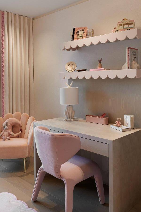 Whimsical pastel scalloped shelves from @laurahammett.interiors add playful charm to a pink teenage girl bedroom.