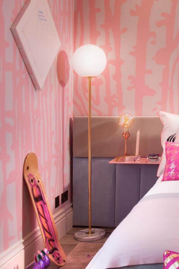 Whimsical coral-painted walls brighten a playful bedroom from @studiosuss, perfect for creative teen spaces.