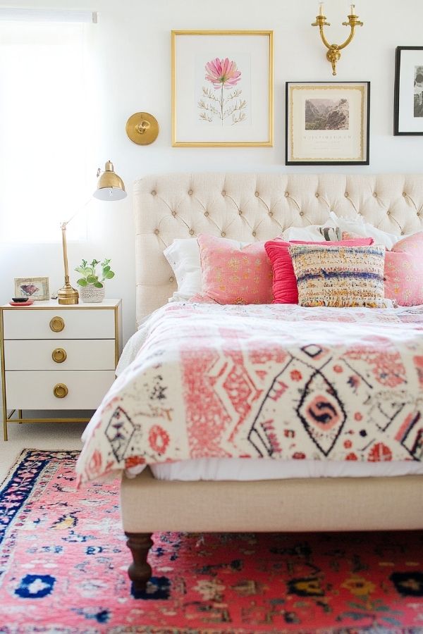 Cozy, colorful textiles with eclectic decor, layered patterns, vibrant accents.