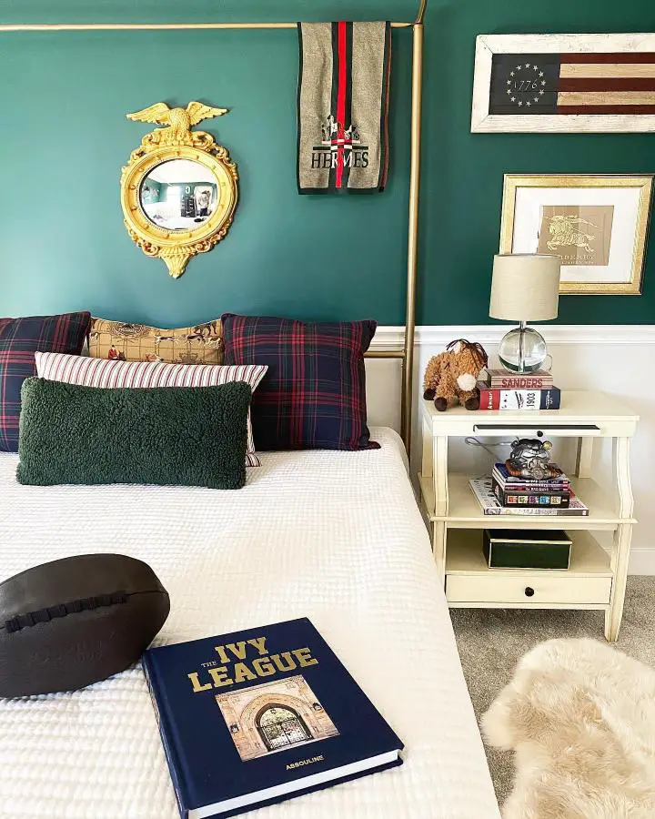 Emerald green bedroom from @brextoncoleinteriors showcasing classic preppy bedroom ideas with plaid pillows and gold mirror.