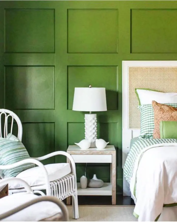 Sage green paneled bedroom from @serenaandlily showcasing timeless preppy bedroom ideas with white furniture and natural textures.