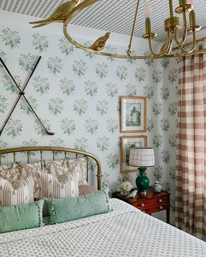 Gingham ceiling bedroom from @thepreppypodcast showcasing creative preppy bedroom ideas with floral wallpaper and brass accents.