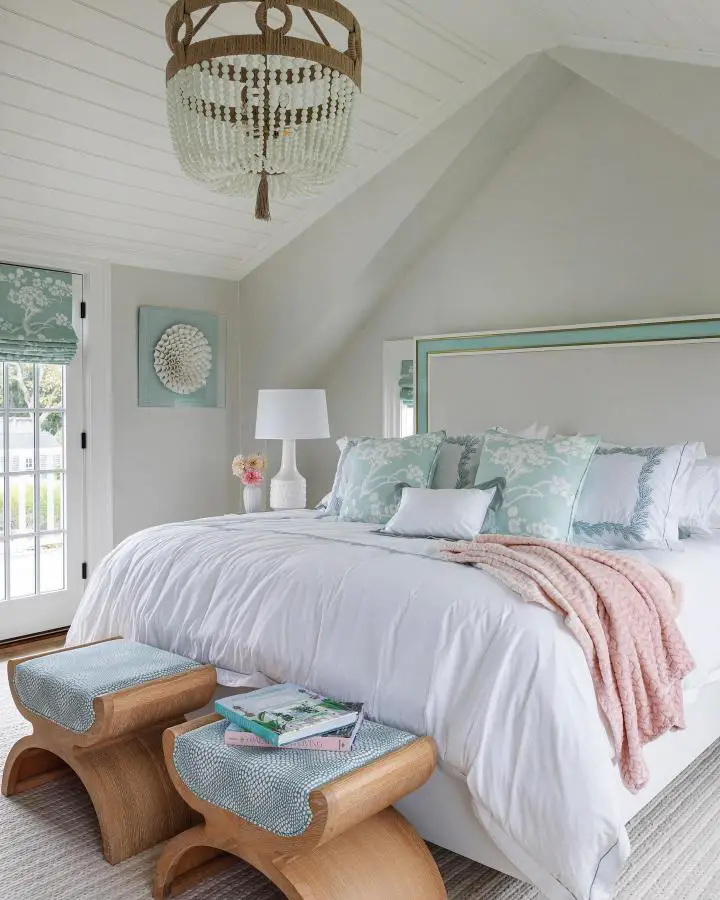 Rope and bead chandelier from @karinlidbeck. Coastal bedroom with mint green accents and vaulted white ceiling.