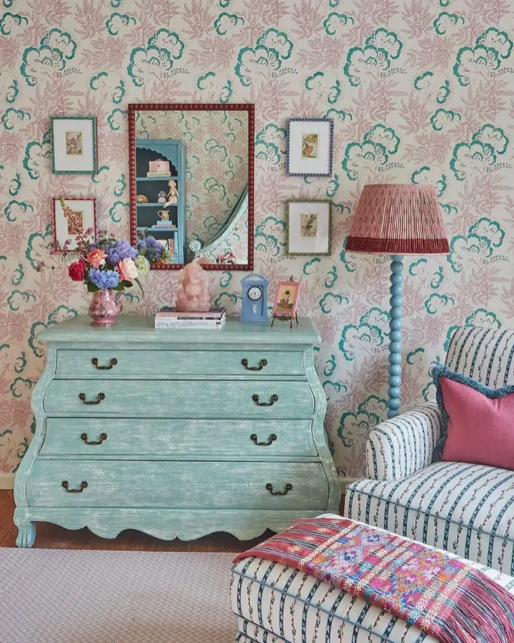 Floral wallpaper bedroom from @elizabethhaydesign showcasing pretty bedroom ideas with mint dresser and striped seating.