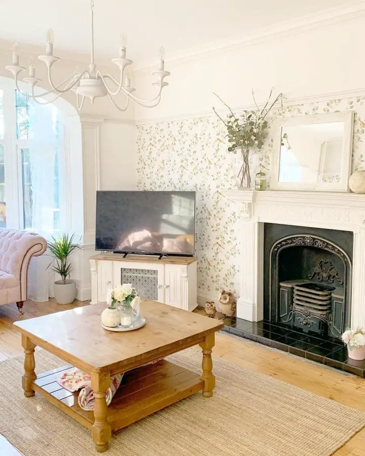 Cream floral wallpaper living room from @mrskinthecountry showcasing pretty living room ideas with botanical accent wall.