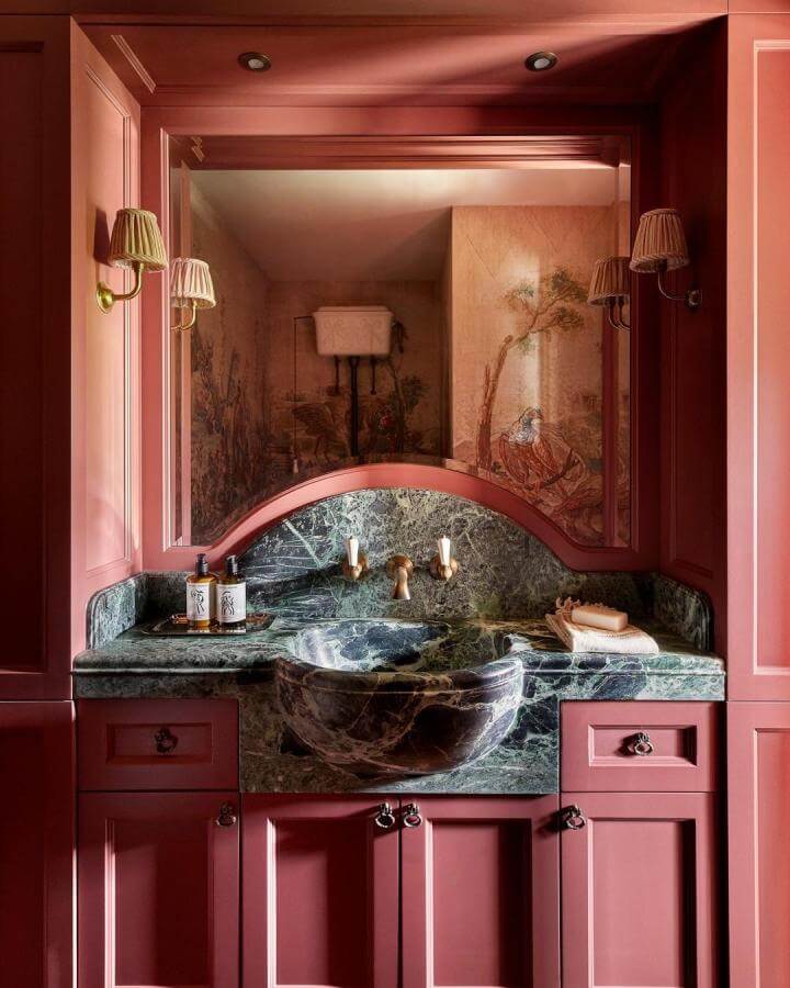 deep red powder room with green marble sink and elegant chinoiserie wallpaper by @candylondonofficial showcasing red powder room ideas