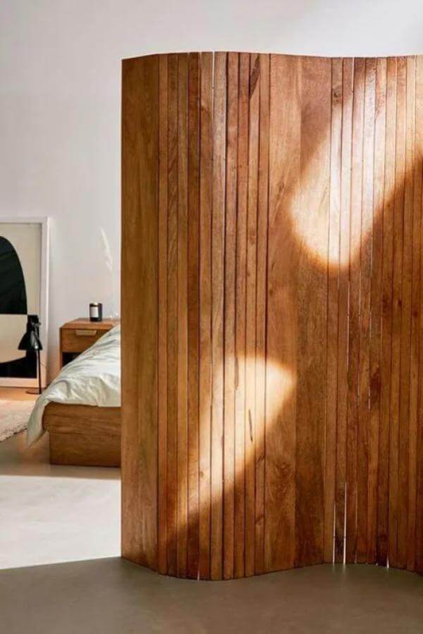 Sunlit curves enhance natural wood for elegant room divider ideas.