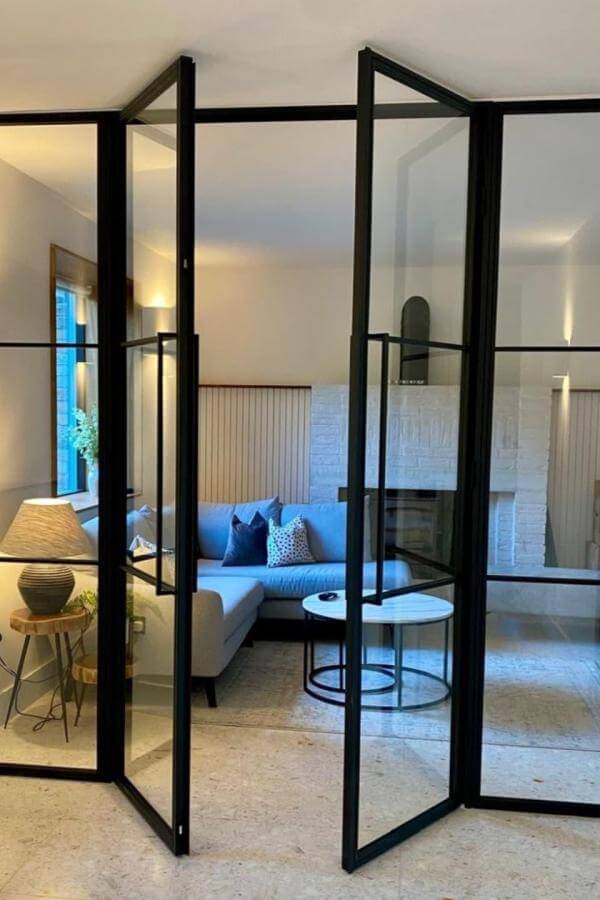 Sleek glass panels enhance ambiance, modernizing spaces with stylish room divider ideas.