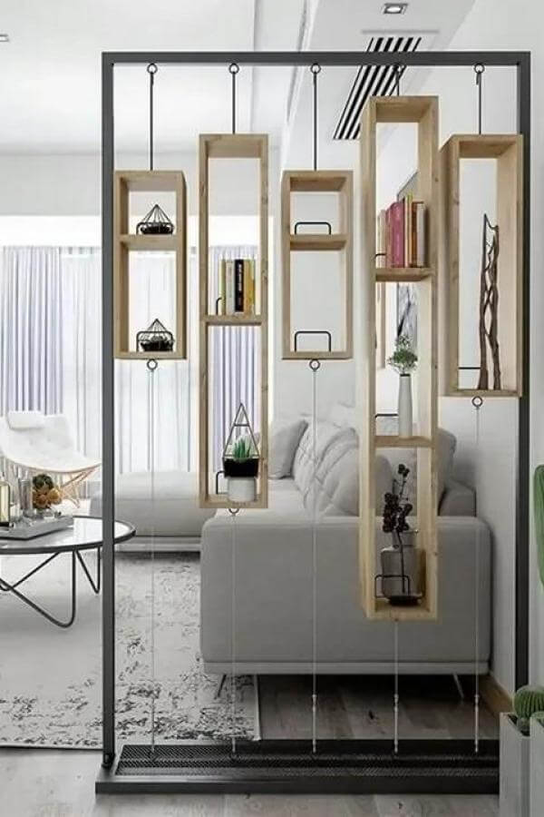 Floating geometric bookshelves enliven space, serving as stylish room divider ideas.