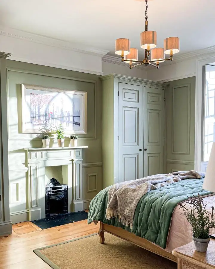 Sophisticated sage green bedroom ideas from @sheslisted featuring full wall paneling and built-in storage solutions.