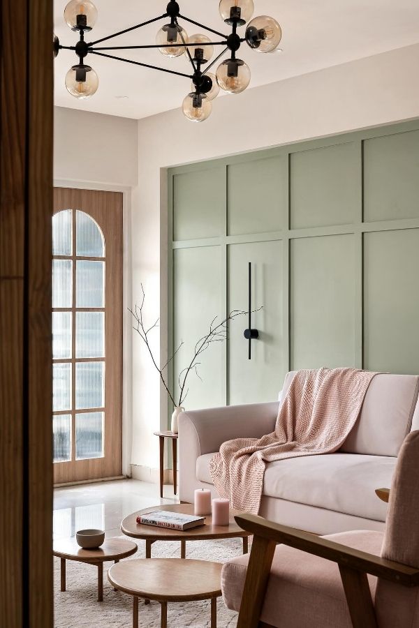 Sage green living room with blush throw, highlighting chic decor. #SageGreenLivingRoomIdeas