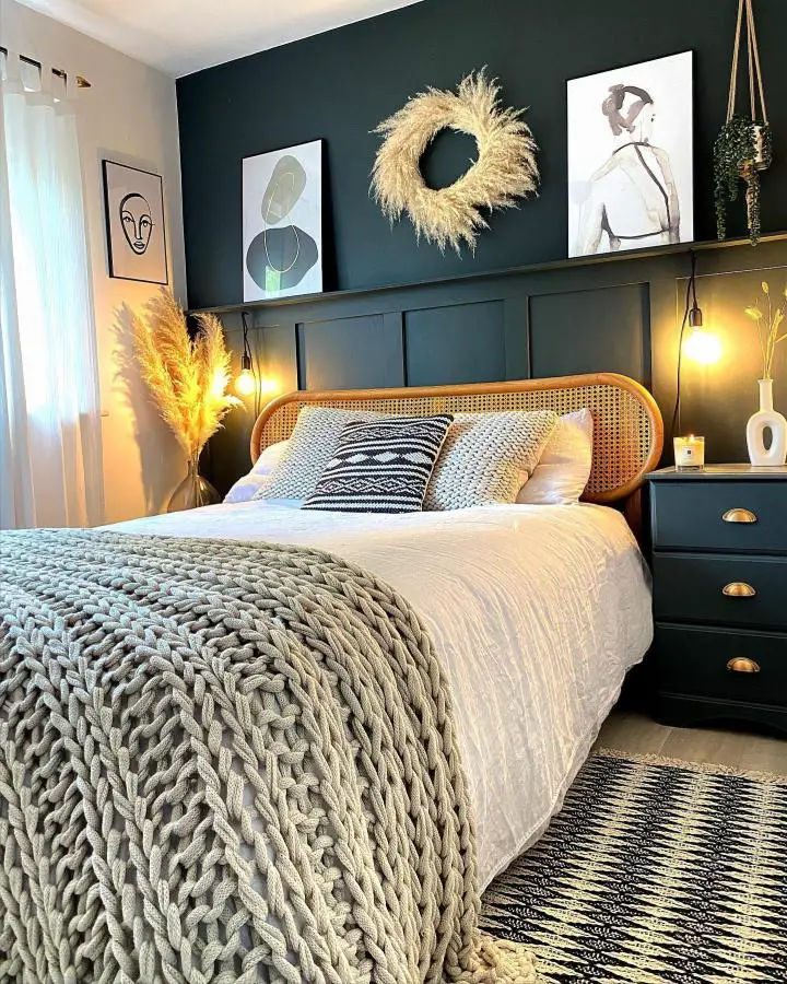 Forest green bedroom from @my_neutral_place featuring natural cane headboard and neutral textiles with warm lighting.