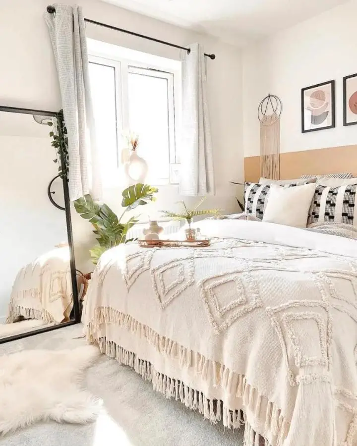 Cream tufted throw blanket from @vcrossingapts. Bohemian bedroom styling with geometric patterns and natural textures.