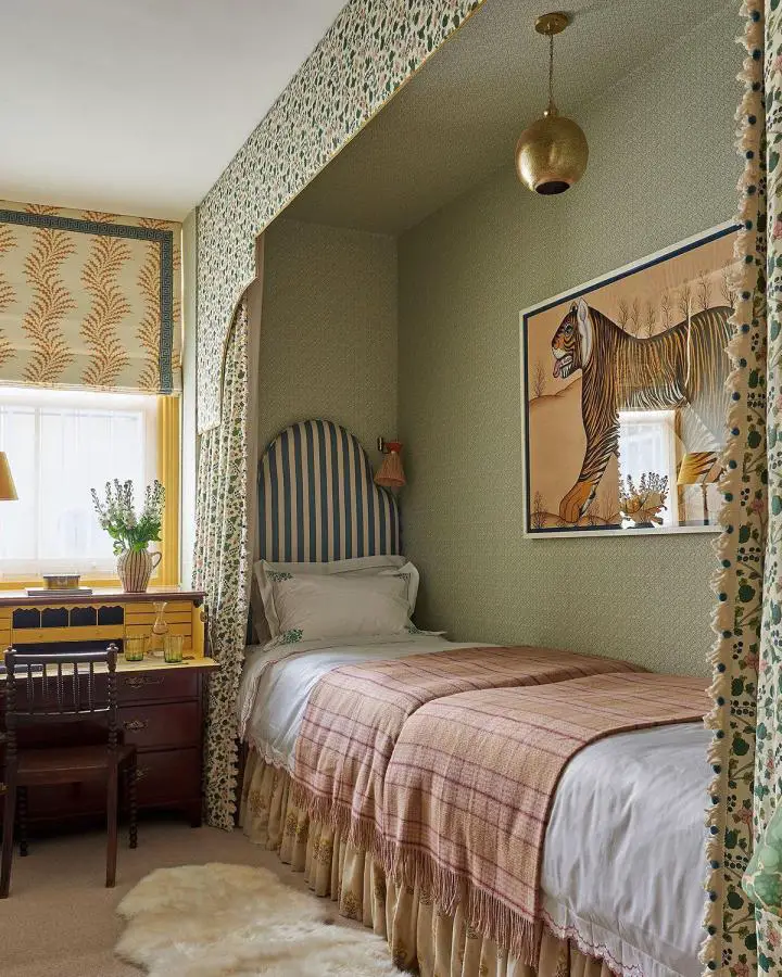 Olive green alcove bedroom from @englishhomemag showing built-in bed nook with striped headboard for small bedroom ideas.