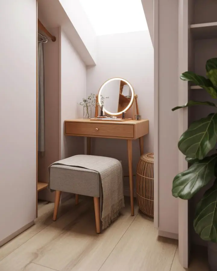 Modern wood vanity station with LED mirror and neutral upholstered stool. Natural lighting highlights minimalist design.