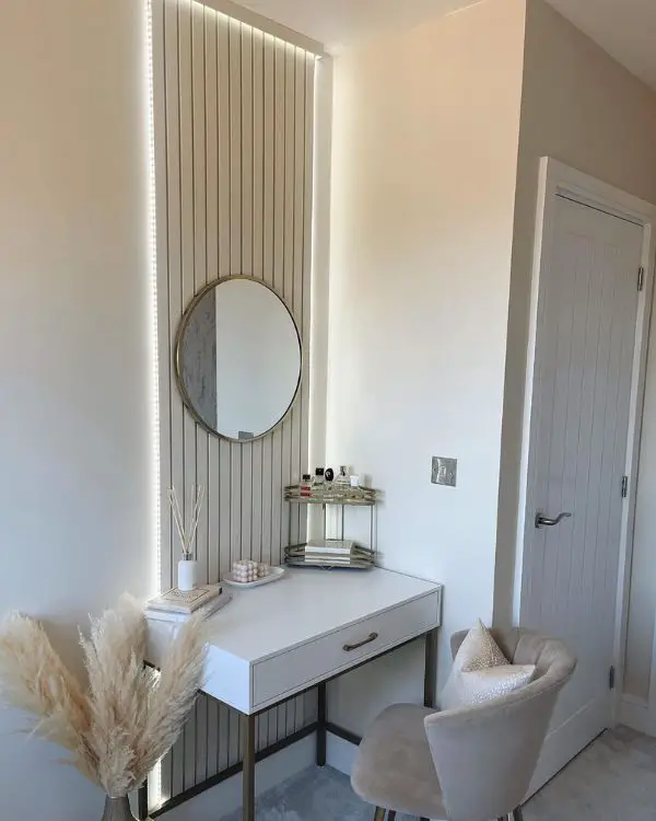 Backlit wood slat wall with vanity setup from @neutral_homes_feature showcasing small dressing room ideas with LED lighting.