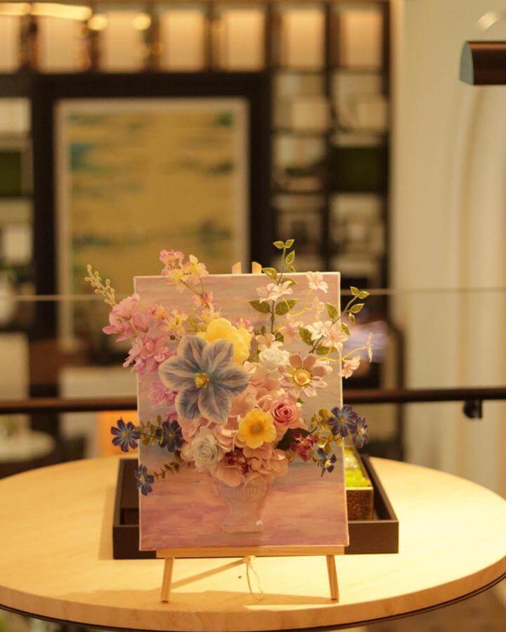3D pastel floral canvas art from @floralsuppliesofficial. Spring crafts for adults with layered paper flowers and greenery.