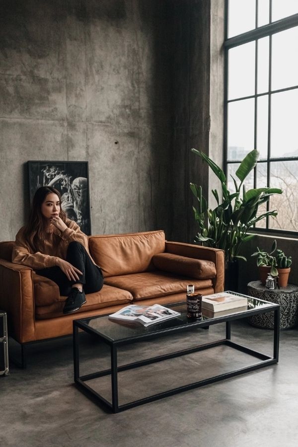 Tan leather couch living room, cozy setup with modern decor accents.