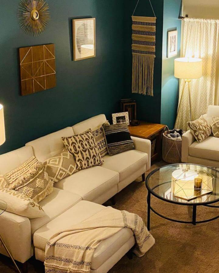 Teal wall living room by @sugargems_design with cozy white sofa, neutral pillows, and layered textures for teal living room ideas.