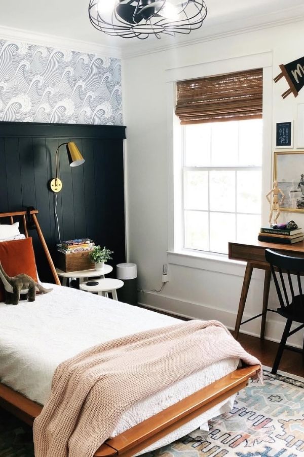 Cozy nautical-themed bedroom with modern decor, blue accents, and anchors.