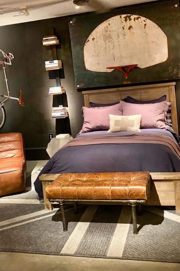 Industrial-chic bedroom featuring exposed brick, metal accents, and vintage decor.