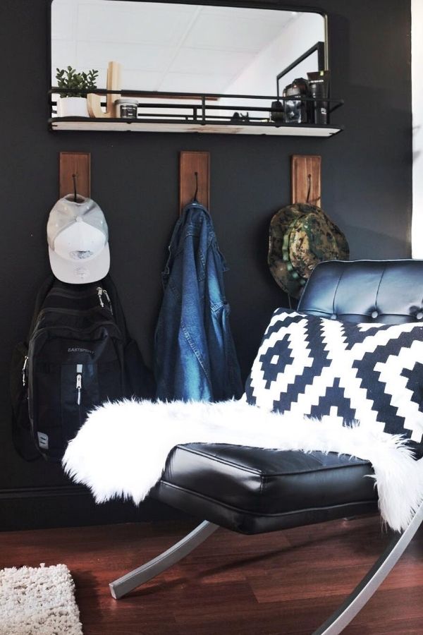 Minimalist black and white corner with sleek furniture and decor.