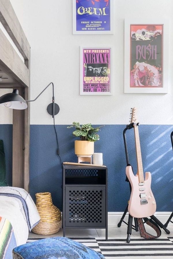 Vintage-inspired bedroom featuring music-themed posters and cozy, artistic vibe.