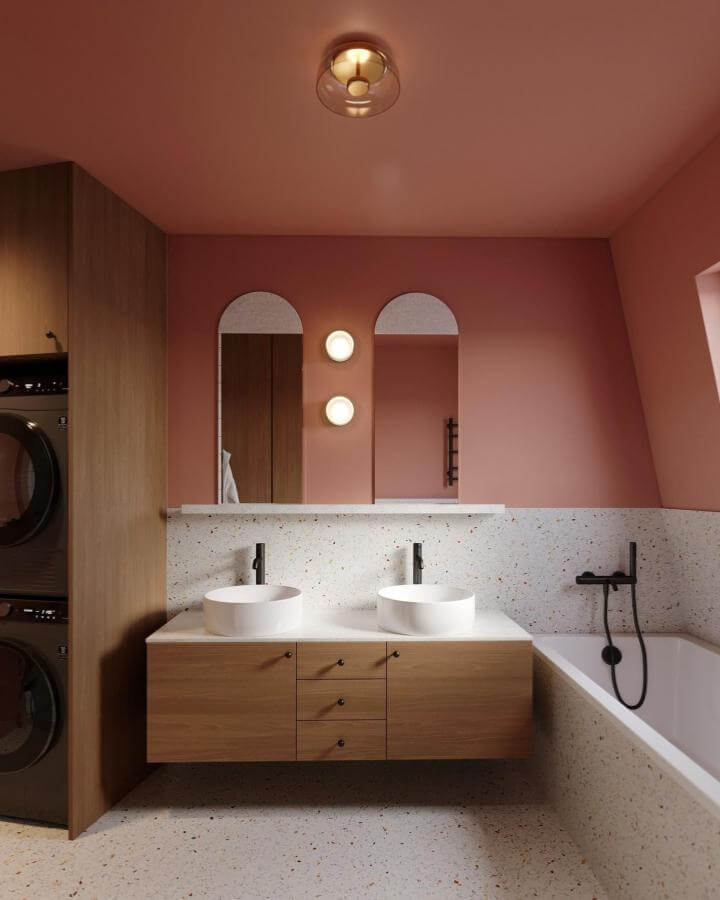 Terracotta walls and terrazzo bathtub surround with sleek wood vanity in minimalist bathroom by @in_and_more showing earthy modern style.