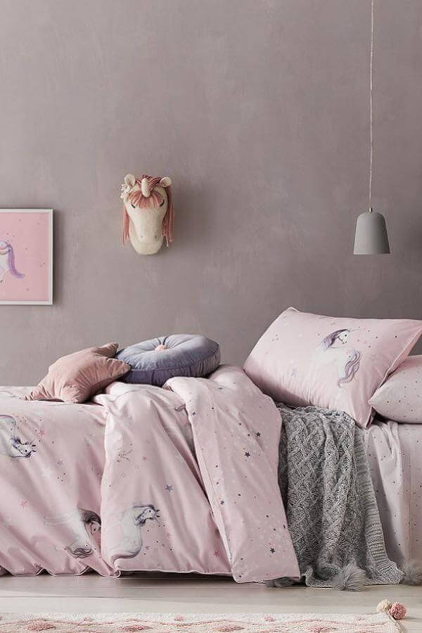 Pastel pink bedding from @adairskids creating an enchanting unicorn dreamscape perfect for whimsical slumber.