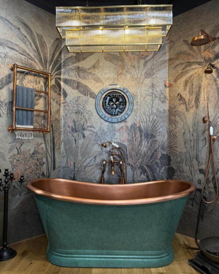 Copper and green freestanding bathtub with vintage botanical wall mural and brass fixtures from @astonmatthewsbathrooms Victorian bathroom ideas stylish design