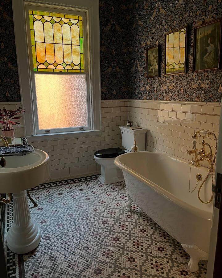 Victorian bathroom ideas clawfoot tub with stained glass window and intricate mosaic tile floor from @lamoss01 vintage style bathroom interior.