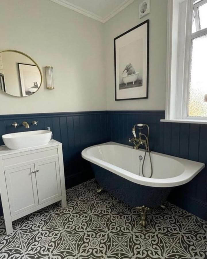 Navy wainscoting clawfoot bathtub patterned tile floor victorian bathroom ideas by @elmazconstruction classic and inviting space
