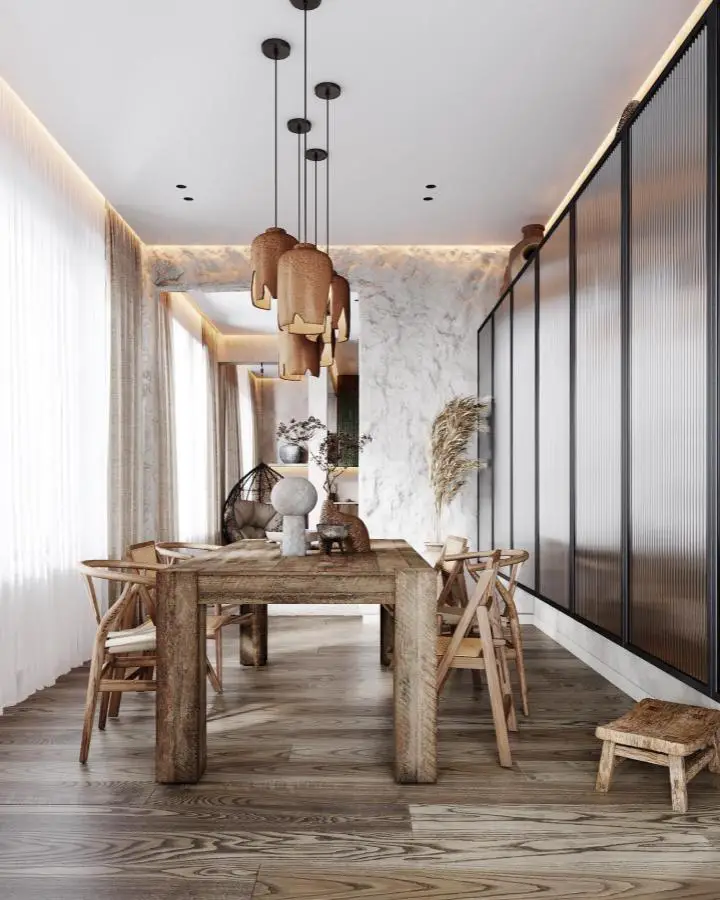 Weathered wood dining table from @yana_design_home showcasing natural textures for wabi sabi dining room ideas.