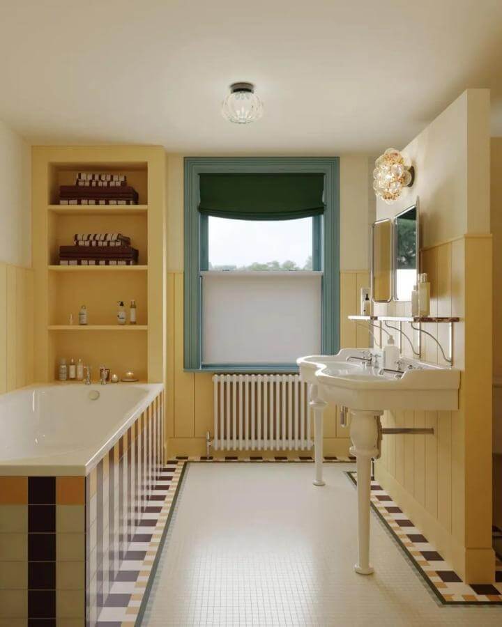 Yellow wainscoted bathroom featuring black and cream tiles with teal window trim from @appreciationprojectuk yellow bathroom ideas bright and warm.